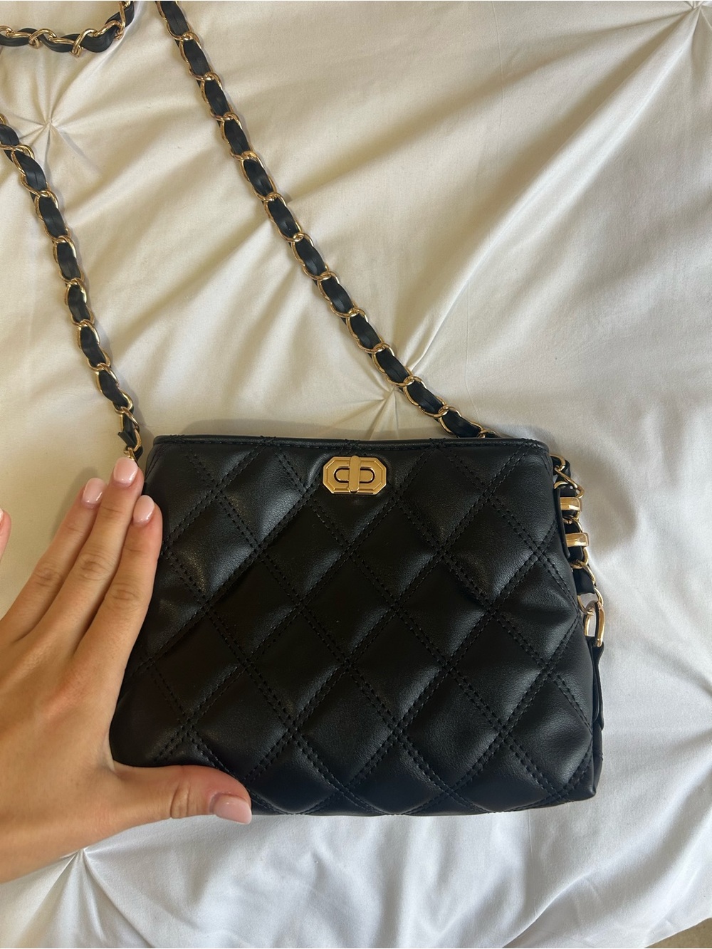 Black quilted purse with gold hardware